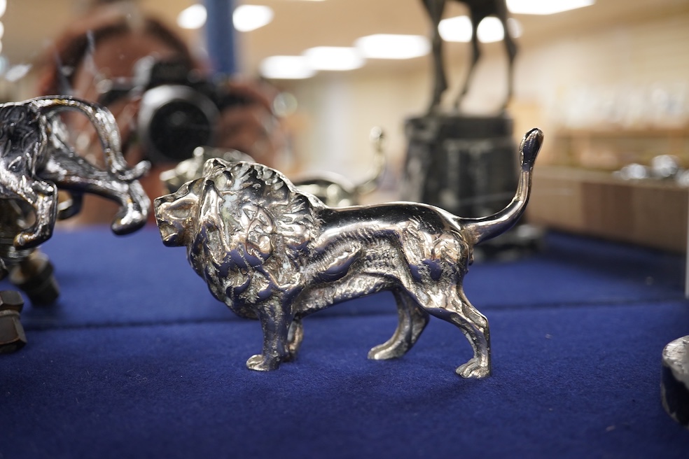 Four lion and big cat related brass and chrome car mascots/figures, consisting of two lions, a tiger and another, possibly a panther. Condition - fair, some losses to chrome.